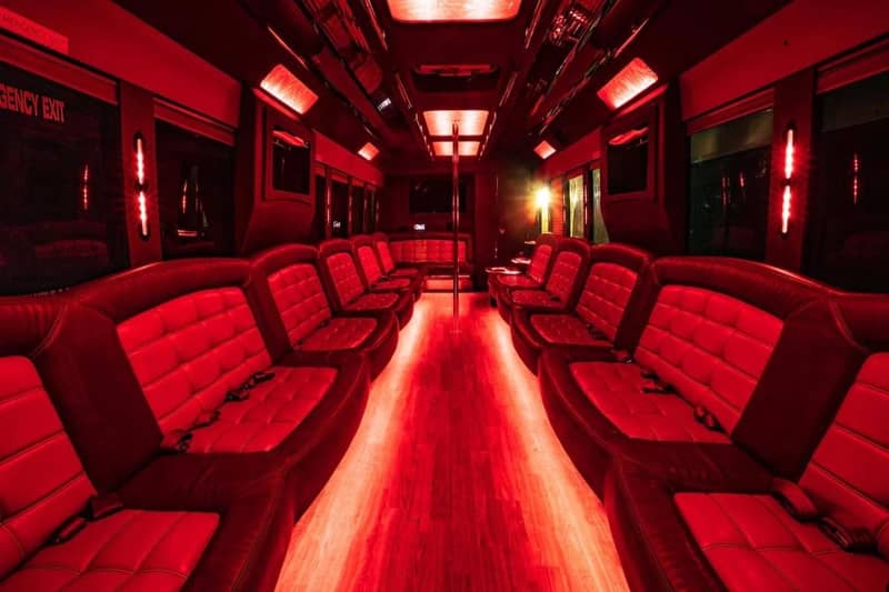 Party Bus — 40–50 Passenger — 50 passenger party bus interior with red leather seating